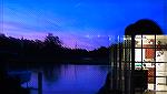 Reflections in a waterfront window at dusk on Manklin Creek.