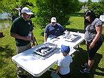 Fish identification table at Ocean Pines Anglers Club annual Teach A Kid to Fish day.