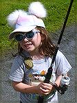 Young Angler wins drawing for Mike Vitak custom rod and reel at Ocean Pines Angler Club Teach A Kid to Fish day.