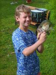 Chance Hardesty shows off his Large Mouth Bass caught in the 8-11 age group at the Ocean Pines Anglers Club annual Art Hansen Memorial Youth Fishing Contest.