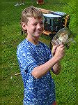 Chance Hardesty shows off his Large Mouth Bass caught in the 8-11 age group at the Ocean Pines Anglers Club annual Art Hansen Memorial Youth Fishing Contest.