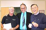 Joe Reynolds (right) schmoozes with OPA VIPs Police Chief James Leo Ehrishman (left) and OPA Board Member Stuart Lakernick during a coffee-donut meet and greet period prior to the last board meeting. 