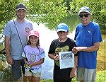 Grand Prize Drawing winners, L to R; Mike Vitak with his custom rod and reel winner Eva Thompson, Mitchell Leisure, Angler trip winner, Doug Murphy, Angler Representative.