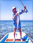 Joe Reynolds with a fly-caught barracuda in the waters of Dry Tortugas National Park. Circa 1981. Note the "rope fly," simply a long, combed piece of nylon rope tied on a hook.