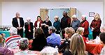 Marie Gilmore (center, holding paper), president of the Worcester County Veterans Memorial at Ocean Pines Foundation and the Foundation's Board of Directors at a Memorial event on December 12, 2023.