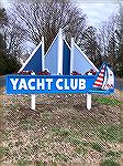 New Yacht Club sign installed at entrance by General Manager.