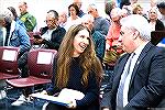 County Commissioner Chip Bertkino talks with reporter Tara Fisher prior to Town Hall.